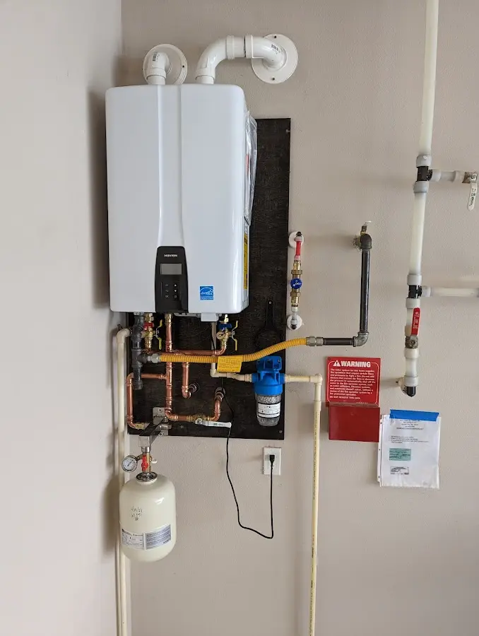 Professional plumber installing copper piping in a Bristol home